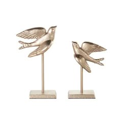 two metal birds sitting on top of each other in front of a white background,