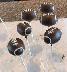 chocolate football cake pops on a table