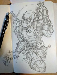 a pencil drawing of a deadpool character on paper next to a pen and marker