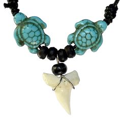 a necklace with an animal, turtle and shell on it