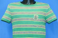 Chest 17 in. Length 26 in. Tag Says: Polo Ralph Lauren, small, made in China, 100% cotton This shirt was made by Ralph Lauren back in the 90s. The shirt features multi-colored horizontal stripes and a single chest pocket that includes a Polo Ralph Lauren seal sewn onto it. Comments: Fits like a modern unisex adult small, striped tee, pocket tee 22-03-114232 Green 90s Style T-shirt For Summer, Casual Multicolor Vintage Print T-shirt, Retro Green Cotton Top, Vintage Striped Short Sleeve T-shirt, Summer Cotton T-shirt With Vintage Print, 90s Style Green T-shirt For Spring, Striped 90s Style T-shirt For Summer, 90s Striped T-shirt For Summer, Striped 90s Style Summer T-shirt