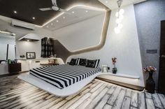 a modern bedroom with black and white decor