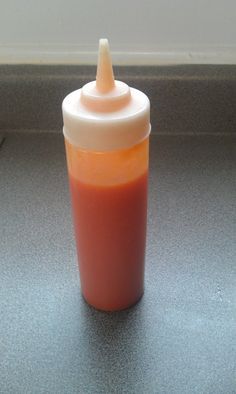 a baby bottle sitting on top of a counter