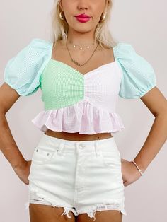 Sweet Seersucker Ruffle Top | Sassy Shortcake | sassyshortcake.com Cotton Puff Sleeve Top With Ruffle Hem For Spring, Trendy Green Cotton Puff Sleeve Top, Multicolor Cotton Puff Sleeve Top, Spring Pink Puff Sleeve Top With Ruffles, Trendy Puff Sleeve Top With Ruffles For Spring, Summer Tops With Balloon Sleeve And Ruffle Hem, Trendy Puff Sleeve Top With Ruffles And Balloon Sleeves, Multicolor Balloon Sleeve Puff Top For Summer, Summer Balloon Sleeve Tops With Ruffle Hem