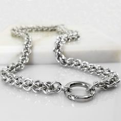 This is a stunning chain that will quickly become an every-day staple, as it easily transitions from casual day-time wear to night-time formal wear, is super lightweight, and is extremely easy to care for.  The chain, consisting of hundreds of bright aluminum rings, has been handcrafted into a beautiful JPL3 chainmaill Silver Minimalist Chain Link Ring, Silver Rolo Chain Necklace For Everyday, Modern Silver Chain Link Ring, Everyday Silver Rolo Chain Necklace, Silver Chain Link Ring Made Of Metal, Silver Chain Bracelet With Chain Strap, Silver Metal Chain Link Ring, Adjustable Link Chain Ring In Metal, Silver Chain Metal Ring