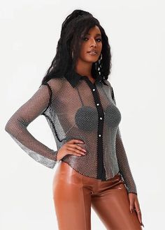 Elevate your wardrobe with our Sparkling Rhinestone Decor Long Sleeved Sheer Shirt. This exquisitely designed shirt features a black sheer fabric adorned with sparkling rhinestones, offering a sophisticated and elegant look. Perfect for any occasion, this shirt will make you stand out with its unique design and exceptional quality. Add a touch of glamour to your style with this must-have piece. Fabric: Slight Stretch Material: Nylon Black Embellished Shirt For Party, Elegant Black Embellished Shirt, Glamorous Sheer Top For Night Out, Elegant Long Sleeve Shirt With Rhinestones, Glamorous Sheer Stretch Top, Chic Black Embellished Blouse, Party Black Embellished Blouse, Black Embellished Party Blouse, Chic Rhinestone Party Blouse