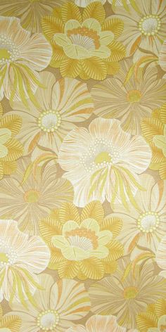 a yellow and white floral wallpaper with large flowers on the back half of it