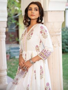 A poetic rendetion of a summer festive collection that makes you nostalgic, in classic luminous block prints. Handcrafted on a bed of fine cotton, mul and doria in hues of pastels. Perfect for light occasions. A set of 3 consists of kurta, staight pant & dupatta. Kurta: A gathered handprinted kurta with mughal buttas on an ivory base. Complete with gota detailing, hand made buttons and lampi work. Dupatta: Handblock printed kota doria dupatta Bottom: Combined with grey straight pants, detailed w Lavender Cotton, Festive Collection, Kurta Designs Women, How To Make Buttons, Kurta Designs, Kurta Set, Straight Pants, Block Print, Printed Cotton