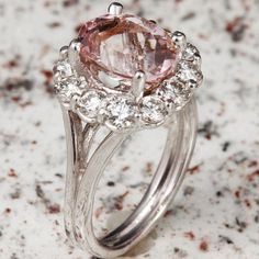 3.70 Carats Exquisite Natural Morganite and Diamond 14K Solid White Gold Ring Suggested Replacement Value: 6,500.00 Total Natural Morganite Weight: Approx. 2.35 Carats Morganite Measures: Approx. 10.00 x 8.00mm Natural Round Diamonds Weight: Approx. 1.20 Carats (color G-H / Clarity SI1-SI2) Ring total weight: 6 grams Disclaimer: all weights, measurements and colors are approximate and may vary slightly from the listed dimensions or as seen in the image. All pictures are magnified to show the sma Luxury Morganite Diamond Ring For Anniversary, Luxury Morganite Diamond Ring With Prong Setting, Exquisite Formal Morganite Ring, Luxury Morganite Ring With Prong Setting, Dazzling Formal Halo Ring With Round Stone, Formal Morganite Diamond Ring, Formal Morganite Diamond Ring Fine Jewelry, Formal Morganite Diamond Ring In Fine Jewelry Style, Luxury Morganite Rings For Anniversary