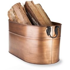 a metal bucket filled with logs on top of a white background