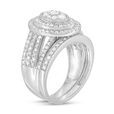 Give her a stunning symbol of your love with this vintage-inspired diamond bridal set. Fashioned in cool 10K white gold, the outstanding engagement ring features an oval-shaped composite of diamonds - the largest a 1/10 ct. stone - wrapped in double frame of diamonds and intricate milgrain. The split multi-row shank shimmers with diamonds and milgrain borders. Seal your vows with the coordinating diamond- and milgrain-lined wedding band. Captivating with 1-1/4 cts. t.w. of diamonds and a bright polished shine, this bridal set is destined to be treasured. Oval Diamond Ring For Wedding And Anniversary, Oval Brilliant Cut Ring For Wedding, Oval Diamond White Wedding Rings, Classic Cubic Zirconia Halo Ring For Wedding, Oval Diamond Bridal Sets For Anniversary, Oval Cubic Zirconia Diamond Ring For Wedding, Oval Diamond Cut Wedding Ring, Marquise Cut Halo Setting Wedding Jewelry, Oval Cubic Zirconia Wedding Ring