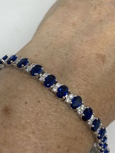 Vintage Cubic Zirconia Bracelet Clear blue Crystal Tennis 7.5 inches All jewelry is shipped free in the US in a nice gift box. Check out our over a THOUSAND great reviews Engraving is $4 per letter and is not always perfect depending on the piece. It can take a few days if the jeweler is busy. This is payable to Paypal Judithsltd@gmail.com Classic Blue Cubic Zirconia Tennis Bracelet, Elegant Blue Bracelets With Sparkling Stones, Classic Blue Bracelet Jewelry, Classic Blue Cubic Zirconia Jewelry, Sapphire Bracelets As A Gift, Classic Blue Bracelets, Classic Blue Jubilee Bracelet, Blue Oval Bracelet As Gift, Blue Oval Bracelet As A Gift