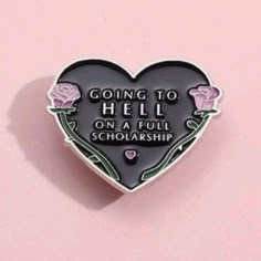 a heart shaped pin with the words going to hell on a full scholarship written in it