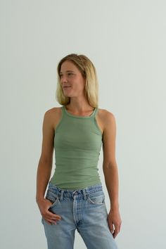 "Best ribbed green tank. Maker: Military Material: 100% cotton stretches Condition: Excellent. Washed Deadstock. XS Chest: 11\" flat un-stretched | Length: 24\" S Chest: 13\" flat un-stretched | Length: 25\" Annika is 5'8\" and is wearing a size X-Small here. SHOP http://www.rawsonstudio.etsy.com FOLLOW US + instagram | @_rawson + website | www.shoprawson.com + pinterest | rawson **Please see shop policies for exchange information*" Spring Solid Ribbed Tank Top, Trendy Green Tops For Everyday Wear, Fitted Green Ribbed Top, Fitted Green Tank Top For Spring, Basic Racerback Top For Everyday, Casual Fitted Racerback Camisole, Solid Ribbed Tops With Tank Straps, Trendy Green Camisole With Tank Straps, Fitted Casual Racerback Camisole