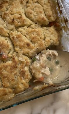 a casserole dish with meat and vegetables in it is ready to be eaten