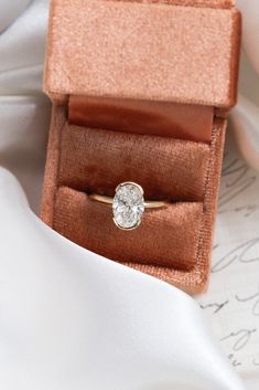 an engagement ring in a velvet box