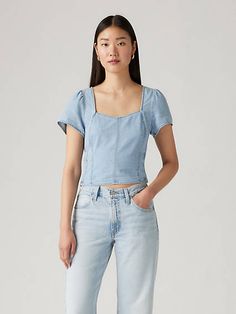 Say hello to the sweetest top in your wardrobe. Our Ophelia Short-Sleeve Denim Corset features a sweetheart neckline, a cropped slim fit and corset detailing. A sweet denim top Cut with a cropped slim fit Finished with corset bone detailing Trendy Cotton Top With Square Neck, Trendy Cotton Square Neck Top, Fitted Light Wash Denim Blouse, Casual Fitted Short Sleeve Denim Top, Trendy Fitted Short Sleeve Denim Top, Cotton Square Neck Top For Spring, Fitted Short Sleeve Denim Top For Spring, Relaxed Fit Cropped Denim Top, Fitted Square Neck Tops For Spring