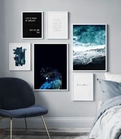 a bedroom with pictures on the wall and a blue chair in front of it next to a bed