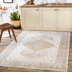 an area rug in the middle of a kitchen