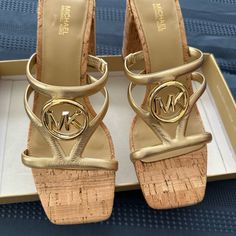 Brand New Beautiful Michal Kors Hampton Gold Sandals With Cork Heel Approx Heel Size 3 Inches Gold Sandals With Cork-bed Midsoles, Gold Mules With Branded Insole For Spring, Gold Heels With Cushioned Footbed, Gold Mules With Cushioned Footbed, Gold Open Toe Mules With Cushioned Footbed, Gold Heels With Cushioned Footbed And Open Heel, Gold Open Heel Heels With Cushioned Footbed, Gold Espadrilles, Michael Kors Sandals