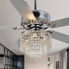 a ceiling fan with a crystal chandelier hanging from it