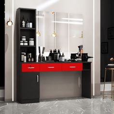 a black and red bathroom vanity with mirror, stools and lights on the wall