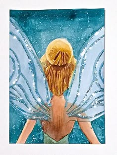 a watercolor painting of a fairy with blue wings and a gold halo on her head