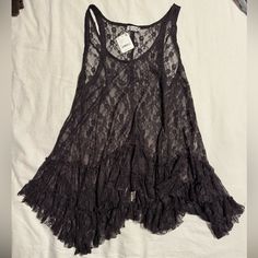 Lace Tunic With Ruffle Bottom In A Dark Brown Color. Xs With Tags Casual Lace Top With Ruffles, Casual Lace Tops With Ruffles, Grunge Lace Top, Sleeveless Lace Tank Top With Ruffles, Black Ruffled Lace Top, Brown Sleeveless Top With Lace Trim, Brown Lace Tank Top, Brown Bohemian V-neck Top, Casual Tanks