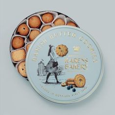 a tin filled with cookies sitting on top of a table