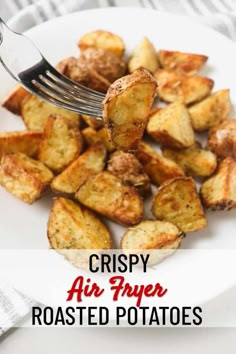 crispy air fryer roasted potatoes on a white plate with a fork in it