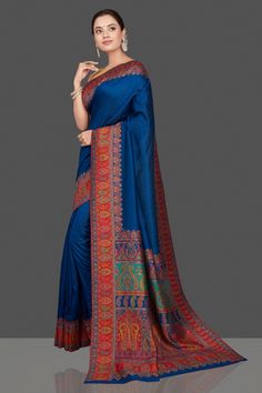 Gorgeous blue multiprint silk saree is a stunning choice for festivals and pre-wedding occasions! It is enhanced with Kani embroidery and comes with a pink blouse piece. Shop silk sarees in USA from Pure Elegance. The shown stitched blouse on the model is for display purpose only. The saree comes with a matching blouse piece and finished with fall and piko. Disclaimer: The actual product may vary slightly from the image. These are custom orders, hence expect slight variation in color, placement Blue Bollywood Tussar Silk Saree, Blue Tussar Silk Saree For Festive Occasions, Festive Blue Tussar Silk Saree, Blue Tussar Silk Dupatta With Printed Border, Blue Silk Traditional Wear With Printed Border, Blue Dola Silk Saree For Navratri, Blue Dola Silk Saree With Traditional Drape, Blue Bollywood Pre-draped Saree In Tussar Silk, Blue Bollywood Pre-draped Tussar Silk Saree