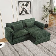 a living room with a large green couch