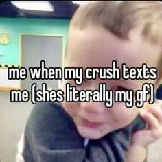 a little boy that is sitting down with his hand on his face and the caption reads, me when my crush texts me i's literally my gf