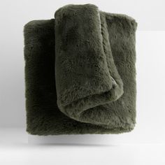 two blankets are folded on top of each other