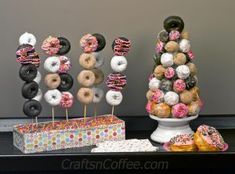 there are donuts on the table next to each other with sprinkles