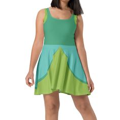 This cute  dress is custom printed, and made of a high quality fabric that is 82% polyester and 18% spandex. It is soft and stretchy, making it perfect for a long day at the theme parks! The fit and flare skater style dress has an elastic waistband, and the flared skirt falls around mid-thigh to above-the-knee. It comes in sizes from XS to 3X!  Please note that there may be some slight differences in the way the physical dress looks compared to the listing photo, since each dress is printed, cut and sewn individually and made by hand. Washing this dress by hand with cold water, and turning it inside out before washing will help keep the fabric at its best! Fitted Green Elastane Mini Dress, Green Sleeveless Elastane Dress, Green Stretch Elastane Dress, Green Stretch Mini Dress In Elastane, Green Printed Sundress, Fitted Green Mini Sundress, Fitted Multicolor Elastane Dress, Green Sleeveless Swim Dress, Green Sleeveless Mini Dress In Elastane