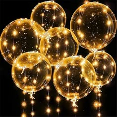 lighted balloons are arranged in the shape of stars