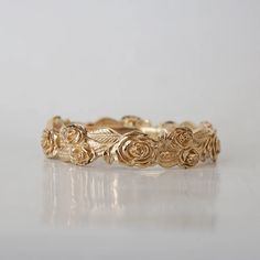 Floral Roses Eternity Band in 14K and 18K Gold – Tippy Taste Jewelry Classic Rose Design Jewelry For Anniversary, Elegant Promise Jewelry With Rose Design, Elegant Yellow Gold Ring With Rose Design, White Gold Rose Design Jewelry For Anniversary, White Gold Jewelry With Rose Design For Anniversary, Delicate 14k Gold Rose Design Jewelry, Elegant Rose Detail Rings For Anniversary, Rose Gold Wedding Jewelry With Rose Details, Rose Gold Wedding Jewelry With Roses