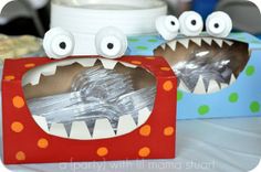 there are two boxes with fake teeth in them and one has eyes on the top