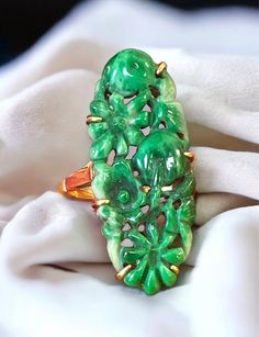 Rare Antique 1920's 18k Yellow Gold Carved Jade Flower Ring Size 5.25 GORGEOUS! Beautiful and extremely well made carved jade ring! * Carvings are of flowers. * Crafted beautifully in solid 18k yellow gold, with a large oval, approximately 18mm x 11mm carved multi-toned green jade oval stone center! * Size 5.25 * Fully Hallmarked and tested 18k yellow gold * Weight: 5.4 grams. * Comes in a gift box, perfect for gift giving! Ships FAST AND FREE, fully insured. I guarantee item to be as described Antique Jade Jewelry, Collectible Gold Jade Jewelry, Antique Engraved Jade Jewelry, Carved Round Jade Jewelry, Traditional Carved Jade Jewelry, Antique Jade, Vintage Carved Jade Jewelry, Tibetan Jewelry, Flower Carving