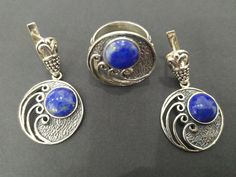 Discover the beauty of Armenian culture with our Sterling Silver 925 round jewelry Set. This armenian jewelry features stunning lapis earrings and a matching ring. Handcrafted with natural blue lapis lazuli, each piece is 925 stamped and comes with a tracking number for secure online shopping. Elevate any outfit with this etsy best jewelry set. This Armenian jewelry boasts an interesting design with unusual ornaments that showcase a unique style. Perfect for those seeking one-of-a-kind pieces to Round Lapis Lazuli Jewelry With Natural Stones, Silver Jewelry Sets With Stone Setting, Elegant Lapis Lazuli Ring Jewelry, Artisan Silver Lapis Lazuli Jewelry, Elegant Jewelry Sets With Natural Stones, Traditional Round Lapis Lazuli Jewelry, Nickel Free Lapis Lazuli Round Jewelry, Stamped 925 Round Lapis Lazuli Jewelry, Bohemian Sapphire Round Jewelry