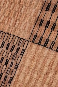 an aerial view of the roof of a building with black and brown lines on it