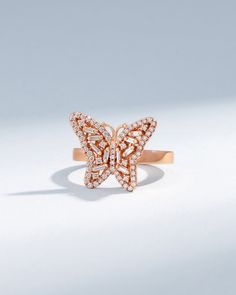 The butterfly symbolizes rebirth and transformation across numerous cultures, and we embrace this powerful meaning too. This handcrafted 18-karat gold butterfly diamond ring is designed to accompany you on your journey of beautiful change. Details 18k yellow gold, rose gold or white gold 0.60 carats of baguette and round white diamonds 19x15mm dimensions Ref: BAR537 Luxury White Gold Butterfly Ring, Luxury Diamond Butterfly Ring, Rose Gold Cubic Zirconia Butterfly Ring For Anniversary, Anniversary Rose Gold Butterfly Ring With Cubic Zirconia, Butterfly-shaped Rose Gold Diamond Jewelry, Rose Gold Diamond Butterfly Ring For Anniversary, Butterfly Shaped Rose Gold Diamond Jewelry, Butterfly Shaped Diamond Jewelry In Rose Gold, Rose Gold Diamond Butterfly Jewelry