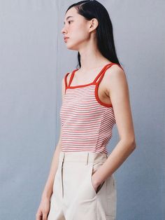 This product is a sleek sleeveless top that features a color block design for a modern and chic look. The square neckline and contrasting straps create a striking visual contrast, while the fitted silhouette highlights the wearer's form. It's a versatile piece that can be dressed up or down, making it a great addition to any contemporary wardrobe. - The top's color block design with contrasting straps adds an eye-catching element to its overall minimalist aesthetic.- A square neckline complements the shoulder-baring style, offering a touch of elegance to this modern piece.- Crafted for a close fit, the top is both flattering and comfortable, ideal for day-long wear.- Its simplicity and stylish cut make it an easy piece to pair with various bottom styles, from tailored trousers to casu Trendy Sleeveless Color Block Tank Top, Fitted Tank Top With Contrast Stripes For Spring, Spring Sleeveless Tank Top With Contrast Stripes, Fitted Sleeveless Top With Contrast Stripes, Sleeveless Summer Tank Top With Contrast Stripes, Summer Sleeveless Tank Top With Contrast Stripes, Sleeveless Tank Top With Contrast Stripes For Summer, Trendy Fitted Color Block Tank Top, Modern Summer Tank Top