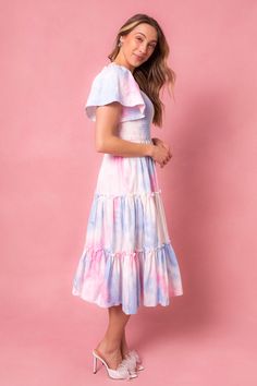 This magical dress is packed with the most whimsical details --- a flowy skirt, super soft 100% cotton, smocked bodice, and a subtle square neck-line that doesn't sacrifice coverage. Perfect for gender reveals, parties and just because. Summer Cotton Smocked Dress With Flutter Sleeves, Spring Dresses With Smocked Bodice And Ruffle Sleeves, Cotton Dress With Smocked Back And Ruffled Straps, Tiered Cotton Smocked Dress With Ruched Detail, Flowy Smock Dress With Square Neck, Cotton Smocked Dress With Flutter Sleeves And Ruffles, Pink Tiered Cotton Dress, Cotton Smocked Dress With Tiered Skirt For Summer, Whimsical Flowy Summer Dress