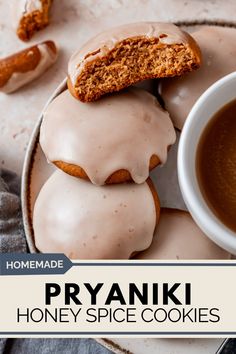 homemade pryanki honey spice cookies are stacked on top of each other with a cup of coffee