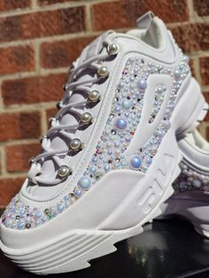 One of a kind Fila Pearl Disrupter trainers/sneakers UK size 7, customised by hand with hundreds of iridescent pearls and swarovski crystals to really give a one of a kind cinderella feel! These would be great for Bride to be, hen party, festival, party or just popping to the shops. Stay sparkley Aimee xx Embellished High-top Sneakers For Streetwear, Sporty Low-top Embellished Sneakers, Sporty Embellished Low-top Sneakers, Embellished Lace-up Sneakers For Streetwear, Crystal Embellished Lace-up Sneakers For Streetwear, Low-top Crystal Embellished Sneakers For Streetwear, Crystal Embellished Low-top Sneakers For Streetwear, White Embellished High-top Sneakers, Bling Sneakers With Round Toe For Streetwear