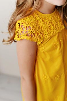 This dress is especially perfect for flower girls. The gorgeous golden color is festive and bright, but also undeniably soft and girly. The yellow lace would also look wonderful with a simple white satin ribbon tied with a hair bow to match. You’ll find this lace dress will be the perfect go-to for special occasions and holidays that she can wear again and again, yet it’s available at an exceptional price. Gold Lace Dress With Lace Trim, Gold Party Dress With Lace Trim, Cute Yellow Dresses With Lace Trim, Cute Yellow Dress With Lace Trim, Yellow Lace Patchwork Dresses, Yellow Lace Dresses With Lace Patchwork, Yellow Party Dress With Lace Patchwork, Yellow Lace Dress For Party In Spring, Yellow Lace Dress For Party