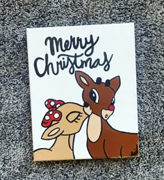 a christmas card with an image of a deer and a reindeer's head on it