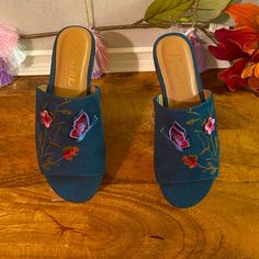 Size: 6 Color: Dark Blue Style: Embroidered Floral Valentina Material: Suede Upper / Man-Made Summer Vacation Blue Mules, Summer Blue Flat Heel Mules, Blue Closed Toe Mules For Summer, Summer Blue Open Toe Mules, Spring Sandals With Floral Embroidery And Round Toe, Blue Open Toe Mules For Summer, Blue Flat Heel Summer Mules, Blue Flat Heel Mules For Summer, Summer Floral Embroidered Heels